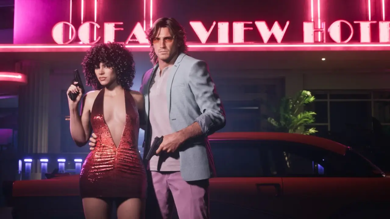 Jason in a pale suit and Lucia in a red sequin dress outside Ocean View Hotel